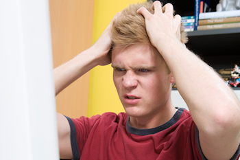 Young man angry at what is on the screen